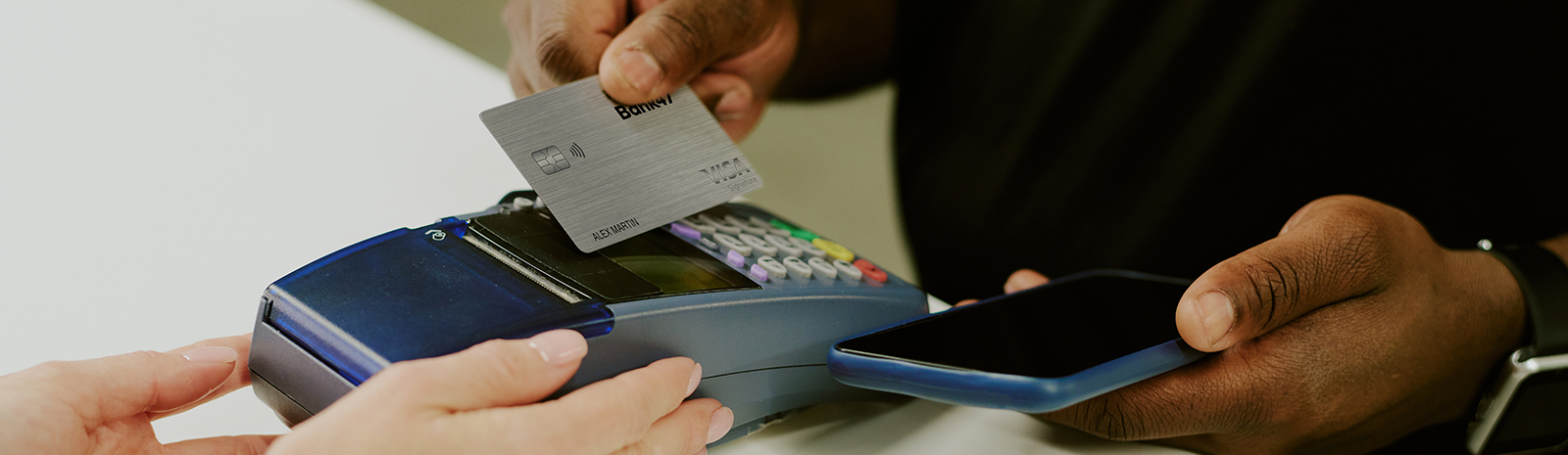 Family on couch looking at computer.